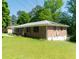 Charming brick home with well-maintained lawn and landscaping, offering great curb appeal at 724 Camelot Way, Norcross, GA 30071