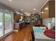 Bright kitchen with wood floors, stainless steel appliances, and a breakfast nook at 724 Camelot Way, Norcross, GA 30071