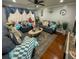 Well-lit living room featuring a ceiling fan, modern furniture, and decorative accents at 724 Camelot Way, Norcross, GA 30071