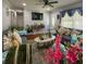 Comfortable living room features a gray sectional, mounted TV, and view to entrance at 724 Camelot Way, Norcross, GA 30071