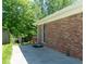 Brick house featuring a cozy outdoor patio with a wooden deck at 724 Camelot Way, Norcross, GA 30071
