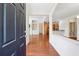 Inviting foyer with gleaming hardwood floors, leading to an open floor plan with views of the kitchen and living areas at 1410 Bluestone Dr, Cumming, GA 30041