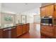 Bright kitchen with stainless steel appliances, granite countertops, and open access to the living room at 1410 Bluestone Dr, Cumming, GA 30041