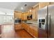 Stylish kitchen featuring granite countertops, stainless steel appliances, and hardwood floors at 1410 Bluestone Dr, Cumming, GA 30041