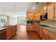 Kitchen showcasing granite countertops, stainless steel appliances, and an open layout with hardwood floors at 1410 Bluestone Dr, Cumming, GA 30041