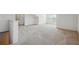 Spacious carpeted bonus room with ample natural light and neutral decor at 1410 Bluestone Dr, Cumming, GA 30041