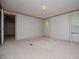 Cozy bedroom with wall-to-wall carpet and a window with neutral blinds at 1530 Mcbrayer Rd, Temple, GA 30179