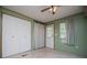 Bright bedroom with closet, doorway, window, and tiled floors at 1530 Mcbrayer Rd, Temple, GA 30179