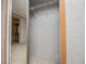 Walk-in closet features ample shelving and leads to bathroom at 1530 Mcbrayer Rd, Temple, GA 30179