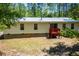 Backyard view of home featuring a deck, siding and a well-maintained lawn, creating an inviting outdoor space at 1530 Mcbrayer Rd, Temple, GA 30179