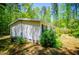 Exterior of a home featuring siding and a landscaped yard, set against a backdrop of mature trees and natural beauty at 1530 Mcbrayer Rd, Temple, GA 30179