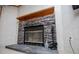 Close up view of a stone fireplace with decorative mantel and hearth adding character to the home at 1530 Mcbrayer Rd, Temple, GA 30179