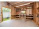Well-lit garage with workbench and storage shelves, perfect for projects and organizing tools at 1530 Mcbrayer Rd, Temple, GA 30179