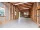 Large garage interior with shelving and work space, ideal for projects and storage in a functional design at 1530 Mcbrayer Rd, Temple, GA 30179