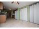 Open kitchen with white appliances, tiled floors, and doorway to another room at 1530 Mcbrayer Rd, Temple, GA 30179