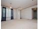 Bright, expansive living room with a large window, neutral carpet, and easy access to adjoining rooms at 1530 Mcbrayer Rd, Temple, GA 30179