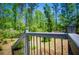 View of the yard with trees and greenery surrounding the house, as seen from the deck at 1530 Mcbrayer Rd, Temple, GA 30179