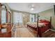 Comfortable bedroom with dark wood floors, and a comfortable bed at 165 Holly Ct, Loganville, GA 30052