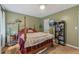Comfortable bedroom with dark wood floors, and a comfortable bed at 165 Holly Ct, Loganville, GA 30052