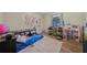 Cozy bedroom featuring hardwood floors, toys, and a rug at 165 Holly Ct, Loganville, GA 30052