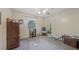 Bedroom with carpet, window, neutral paint, and ceiling fan at 165 Holly Ct, Loganville, GA 30052