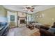 Warm living room with a brick fireplace and wood-look floors at 165 Holly Ct, Loganville, GA 30052