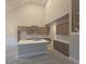 A new kitchen featuring light wood cabinetry, a kitchen island, and white countertops at 3708 Southfield Ct, Loganville, GA 30052