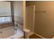 Bright bathroom featuring a soaking tub, shower, and modern fixtures at 4817 Hidden Creek Place, Decatur, GA 30035