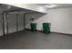 Spacious two car garage featuring an overhead door, utility hookups, and bright lighting at 4817 Hidden Creek Place, Decatur, GA 30035