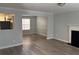 Spacious living room with updated flooring, fireplace and neutral color palette at 4817 Hidden Creek Place, Decatur, GA 30035