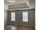 Tranquil main bedroom with tray ceiling, modern vinyl floors, and ample natural light at 4817 Hidden Creek Place, Decatur, GA 30035
