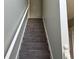 Carpeted staircase with white railings leading to the upper level at 4817 Hidden Creek Place, Decatur, GA 30035