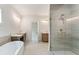 Spacious bathroom showcasing a glass shower, soaking tub, and double vanity at 1005 Liberty Springs Dr, Woodstock, GA 30188