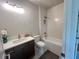 Bright bathroom with tub, updated vanity, and decorative flower at 1005 Liberty Springs Dr, Woodstock, GA 30188