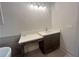 Bathroom featuring modern vanity with dark wood cabinets and quartz countertop at 1005 Liberty Springs Dr, Woodstock, GA 30188