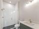Modern bathroom with glass shower, sleek vanity, and stylish tile flooring at 1005 Liberty Springs Dr, Woodstock, GA 30188
