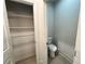 Half-bath with toilet and linen closet at 1005 Liberty Springs Dr, Woodstock, GA 30188