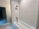Clean bathroom featuring a white tub, bronze fixtures and tiled shower at 1005 Liberty Springs Dr, Woodstock, GA 30188