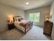 Cozy bedroom with natural light, carpet, and stylish furnishings at 1005 Liberty Springs Dr, Woodstock, GA 30188