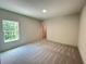 Bedroom with carpet and large window at 1005 Liberty Springs Dr, Woodstock, GA 30188