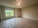 Spacious bedroom with a large window offering natural light and outdoor views at 1005 Liberty Springs Dr, Woodstock, GA 30188