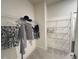 Spacious walk-in closet with ample shelving and hanging space at 1005 Liberty Springs Dr, Woodstock, GA 30188