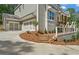 Stunning two-story home with a 2-car garage, stone accents, and professionally landscaped front yard at 1005 Liberty Springs Dr, Woodstock, GA 30188