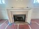 Stone fireplace adds an elegant focal point to the living room at 1005 Liberty Springs Dr, Woodstock, GA 30188