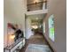 Grand foyer with hardwood floors, high ceilings, an art piece, and an open view to the staircase at 1005 Liberty Springs Dr, Woodstock, GA 30188