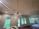 Pendant lights hanging above kitchen island with views to a door and lush green backyard at 1005 Liberty Springs Dr, Woodstock, GA 30188