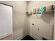 Efficient laundry room with herringbone floors and storage shelf at 1005 Liberty Springs Dr, Woodstock, GA 30188