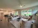 Open-concept living room featuring a fireplace and large windows with lots of natural light at 1005 Liberty Springs Dr, Woodstock, GA 30188