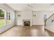 Bright and airy living room with a fireplace and large windows offering scenic views at 1005 Liberty Springs Dr, Woodstock, GA 30188