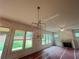 Spacious living room with fireplace and large windows overlooking the backyard at 1005 Liberty Springs Dr, Woodstock, GA 30188